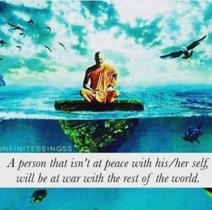 A monk sits on an island in the middle of the ocean meditating